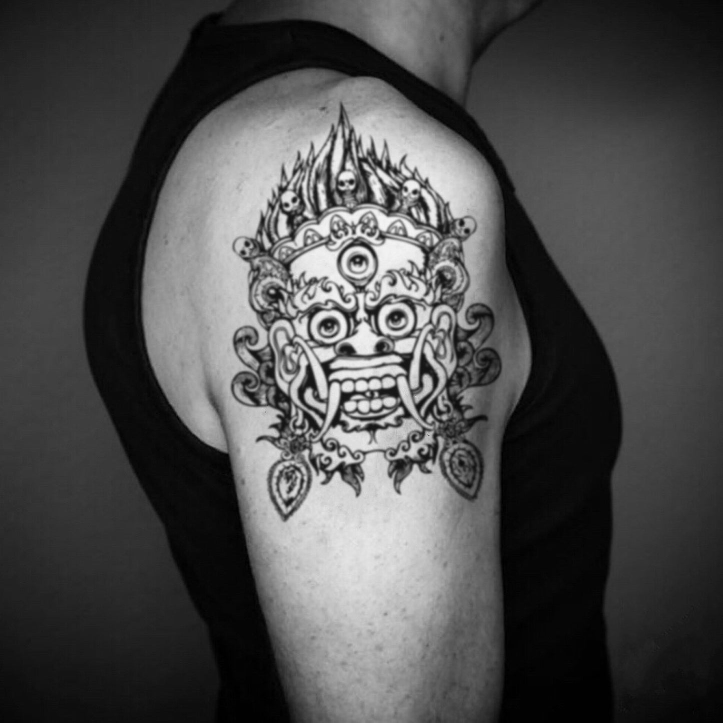 fake big chinese japanese demon mask illustrative temporary tattoo sticker design idea on upper arm