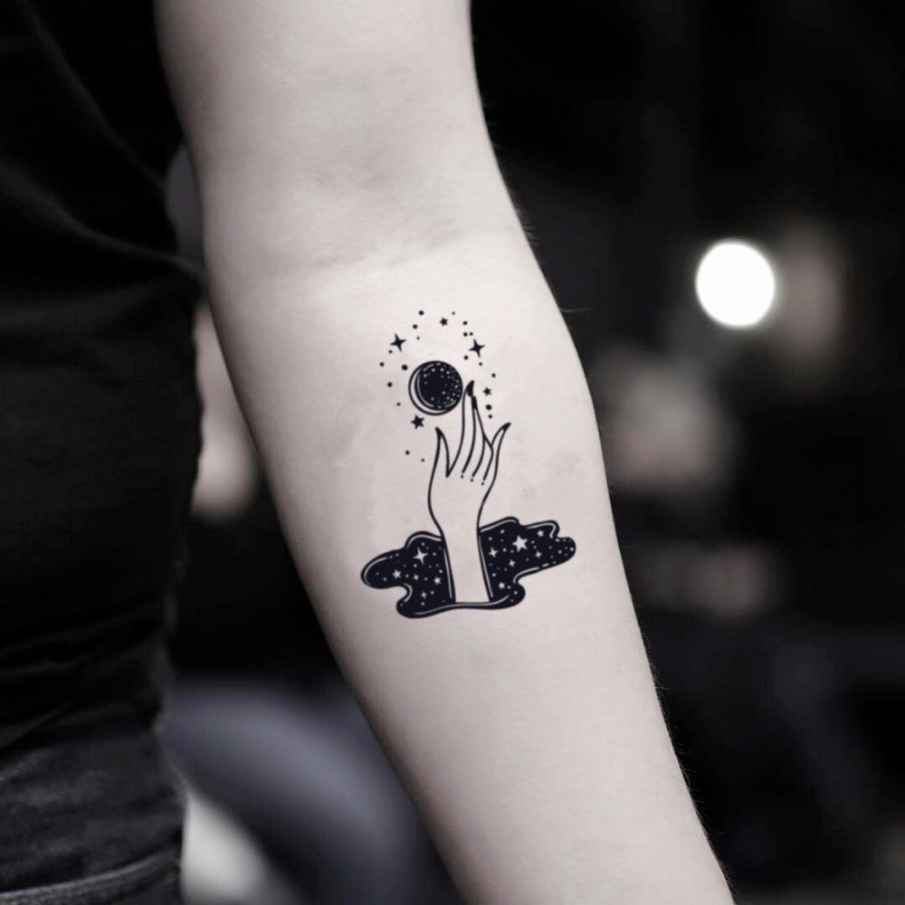 fake small magic hand contemporary edgy whimsical illustrative temporary tattoo sticker design idea on inner arm