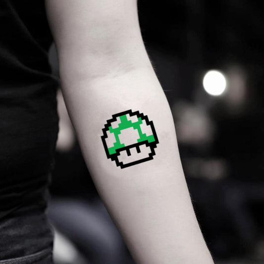 fake small nintendo super mario kart mushroom color temporary tattoo sticker design idea on inner arm