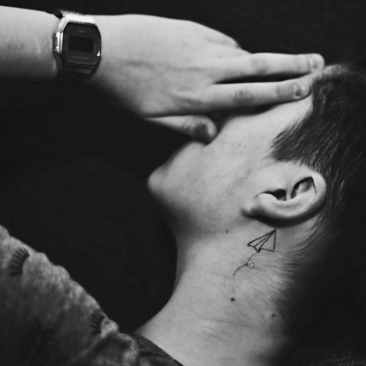 fake small paper plane airplane minimalist temporary tattoo sticker design idea on neck