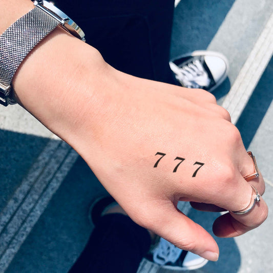 fake small 777 triple 7 lucky numbers lettering temporary tattoo sticker design idea on hand