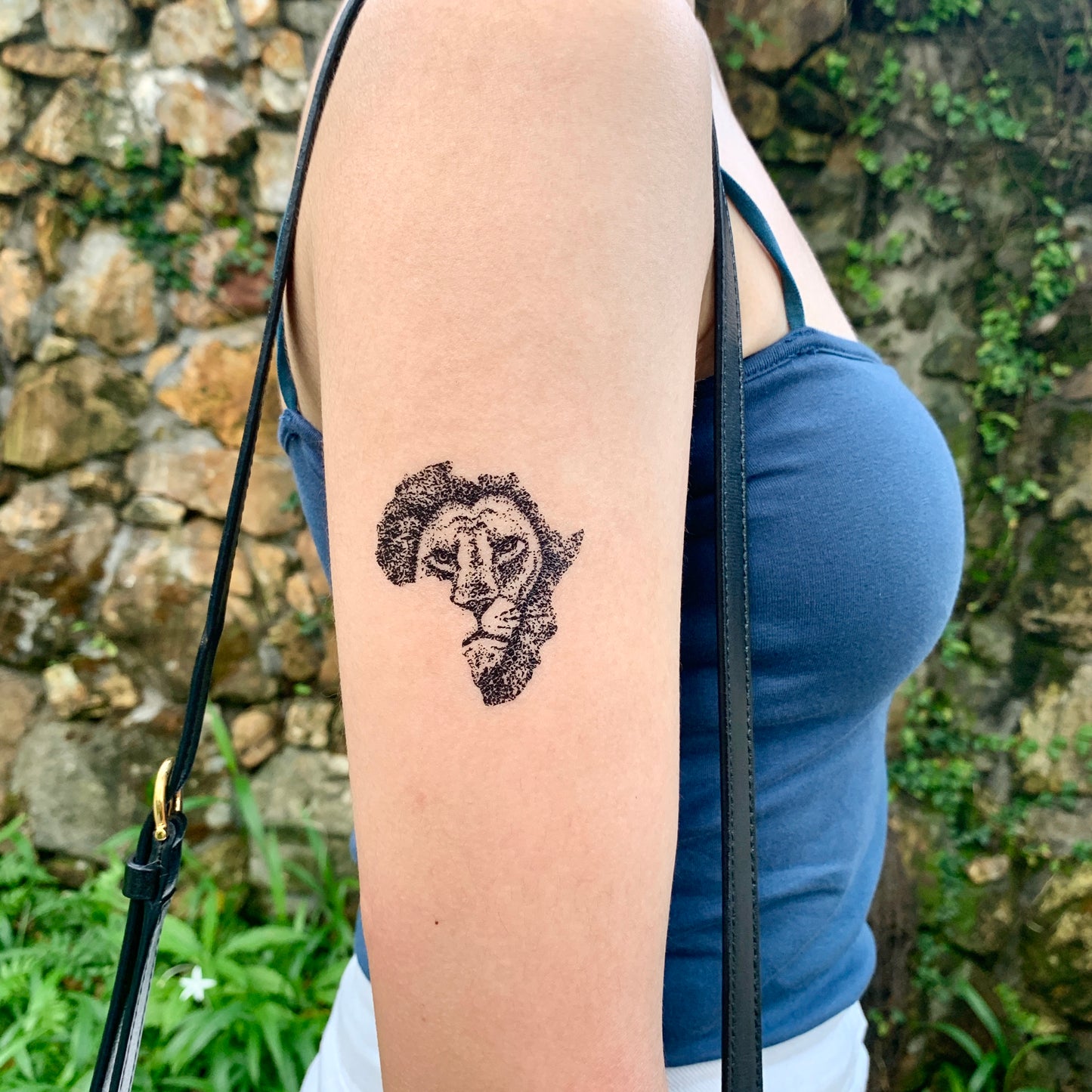 fake small african map lion black culture animal temporary tattoo sticker design idea on upper arm