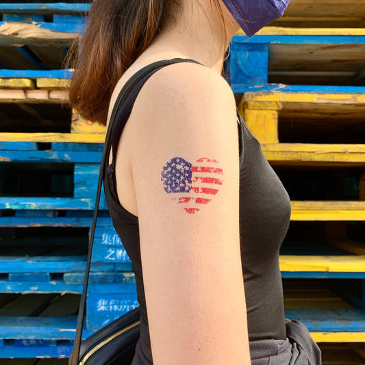 fake small american US pride patriotic heart flag color temporary tattoo sticker design idea on upper arm