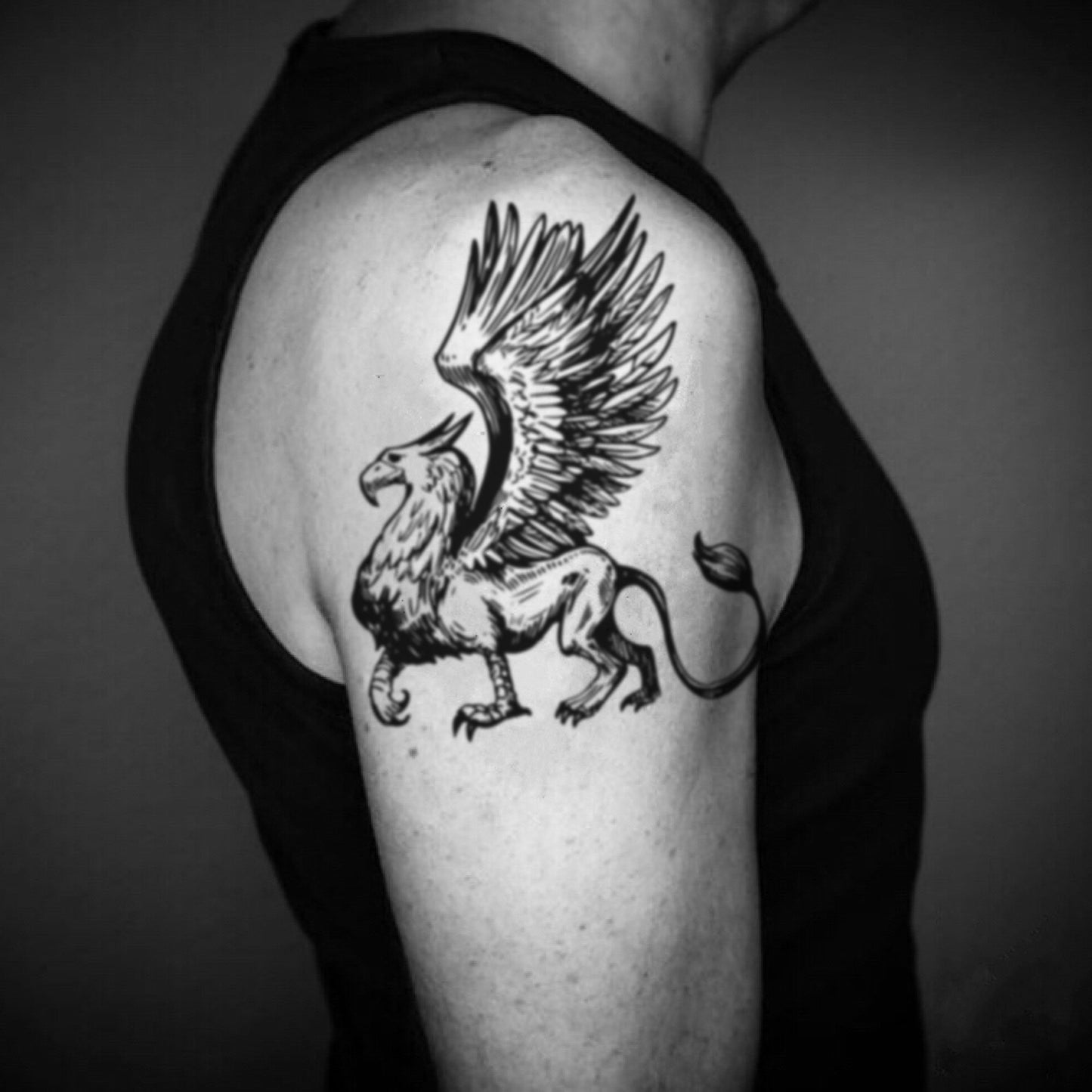 fake big griffin gryphon mythical creature animal temporary tattoo sticker design idea on upper arm