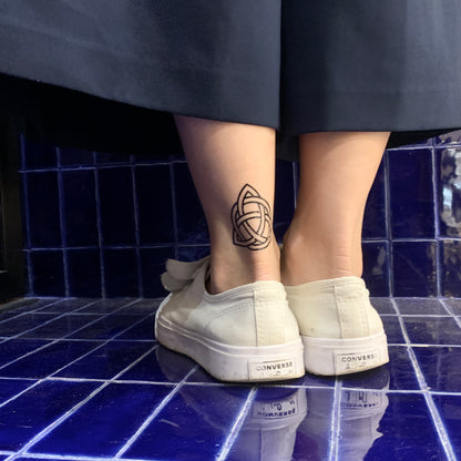 fake small celtic knot holy trinity irish family triquetra geometric temporary tattoo sticker design idea on ankle leg