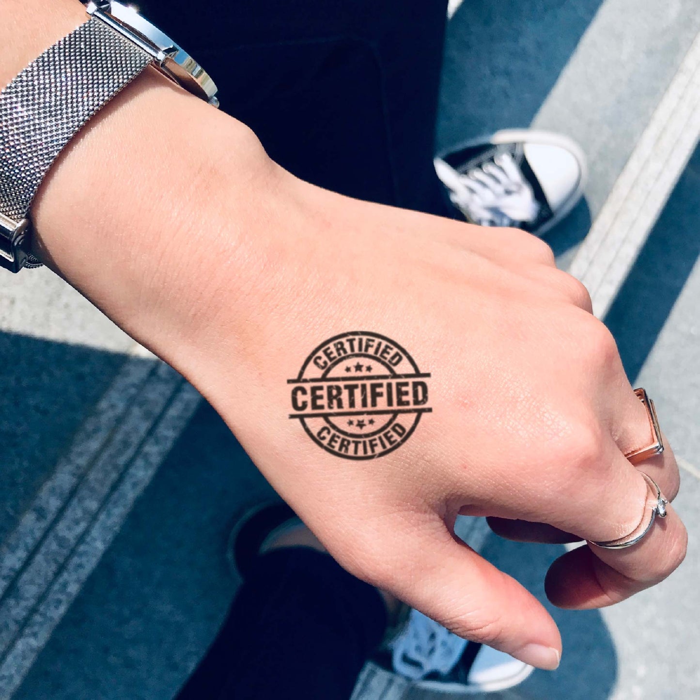 fake small certified stamp script illustrative temporary tattoo sticker design idea on hand