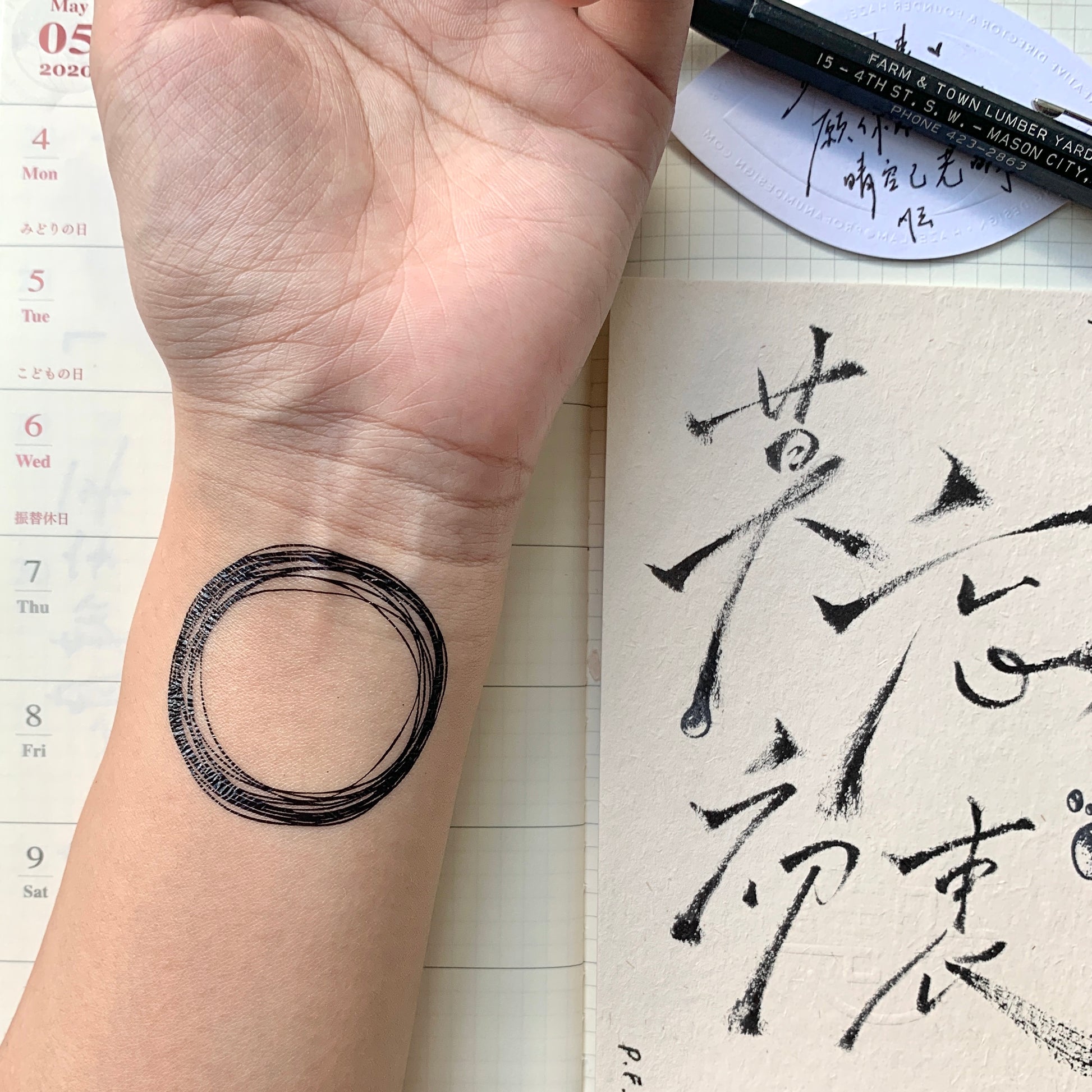 fake small sketch scribble circles geometric temporary tattoo sticker design idea on wrist