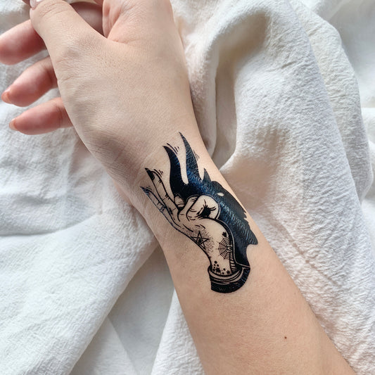 fake small magic idle hand shadow illustrative temporary tattoo sticker design idea on wrist