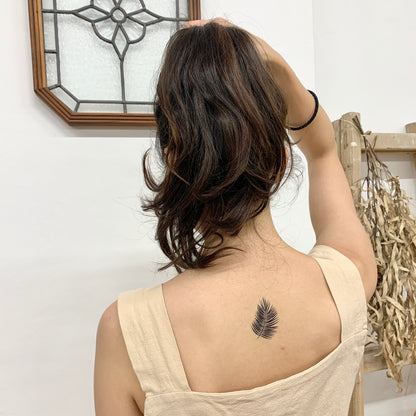 fake small simple palm banana leaf fern frond nature temporary tattoo sticker design idea on neck back