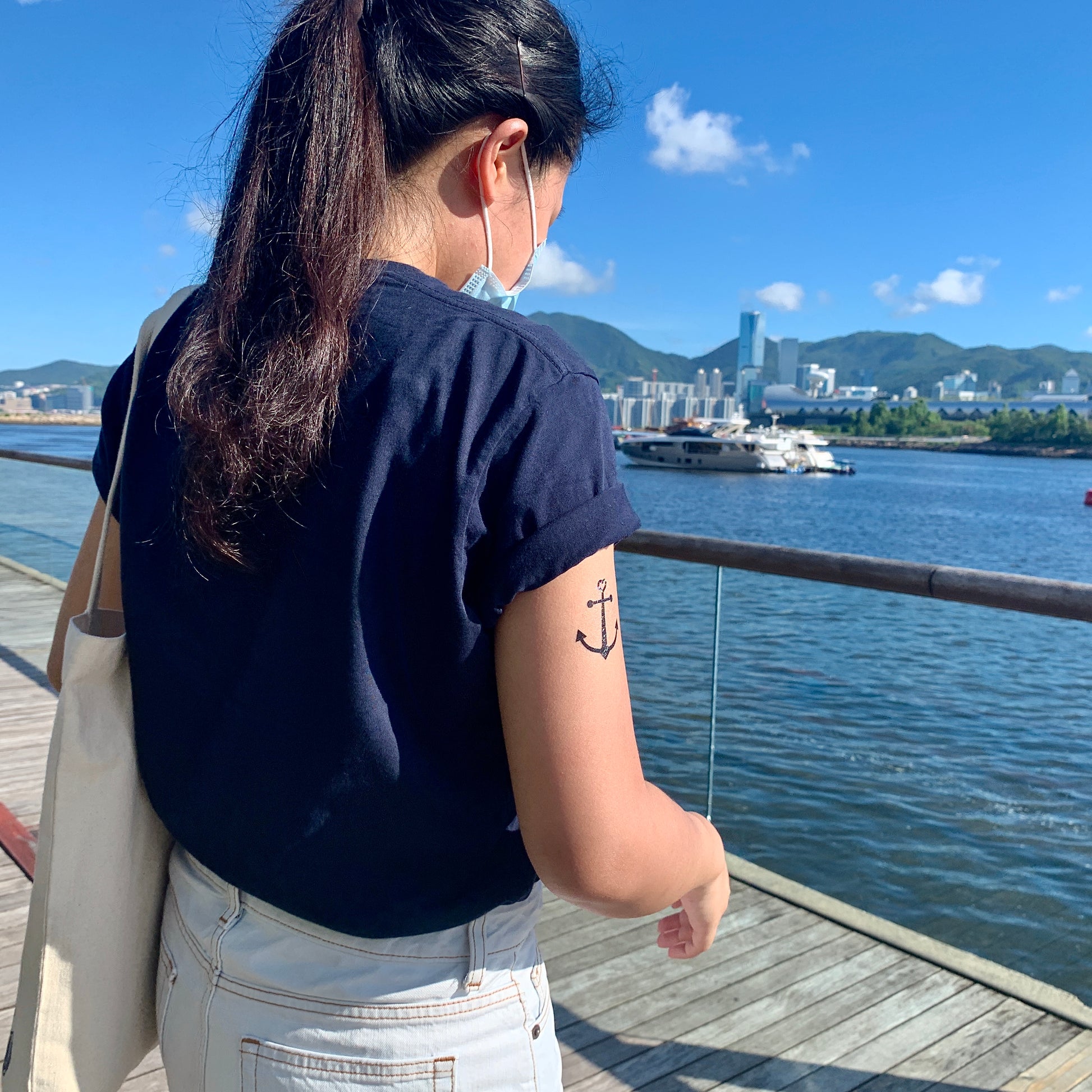 fake small anchor cross heart common minimalist temporary tattoo sticker design idea on upper arm