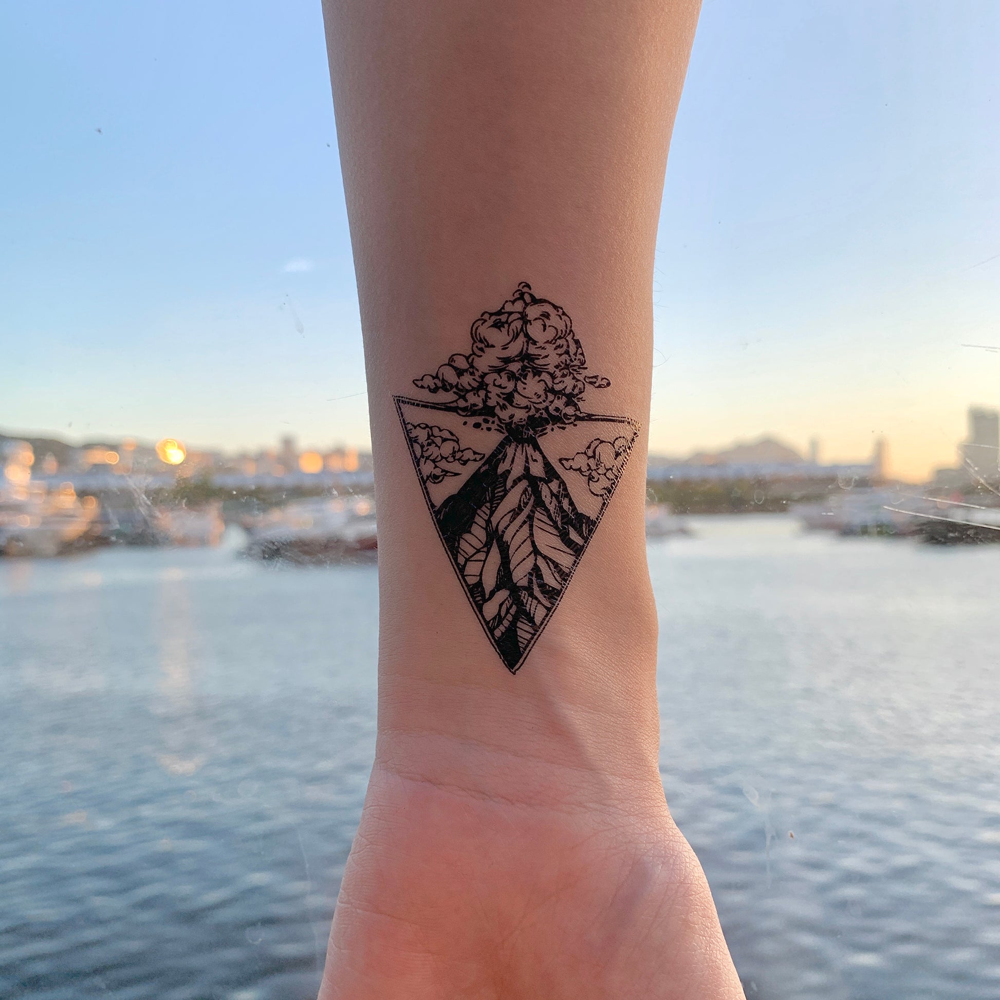 fake small volcano volcanic explosive nature triangle scene temporary tattoo sticker design idea on wrist