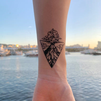fake small volcano volcanic explosive nature triangle scene temporary tattoo sticker design idea on wrist