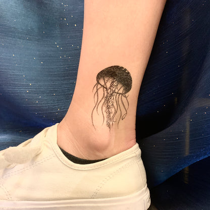 fake small jellyfish animal temporary tattoo sticker design idea on ankle leg