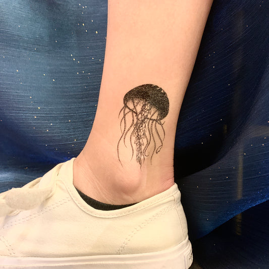 fake small jellyfish animal temporary tattoo sticker design idea on ankle leg