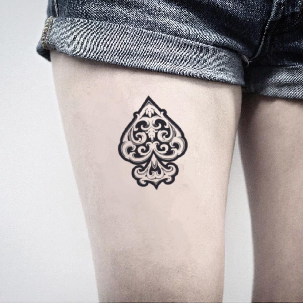 fake medium black ace of spades illustrative temporary tattoo sticker design idea on thigh