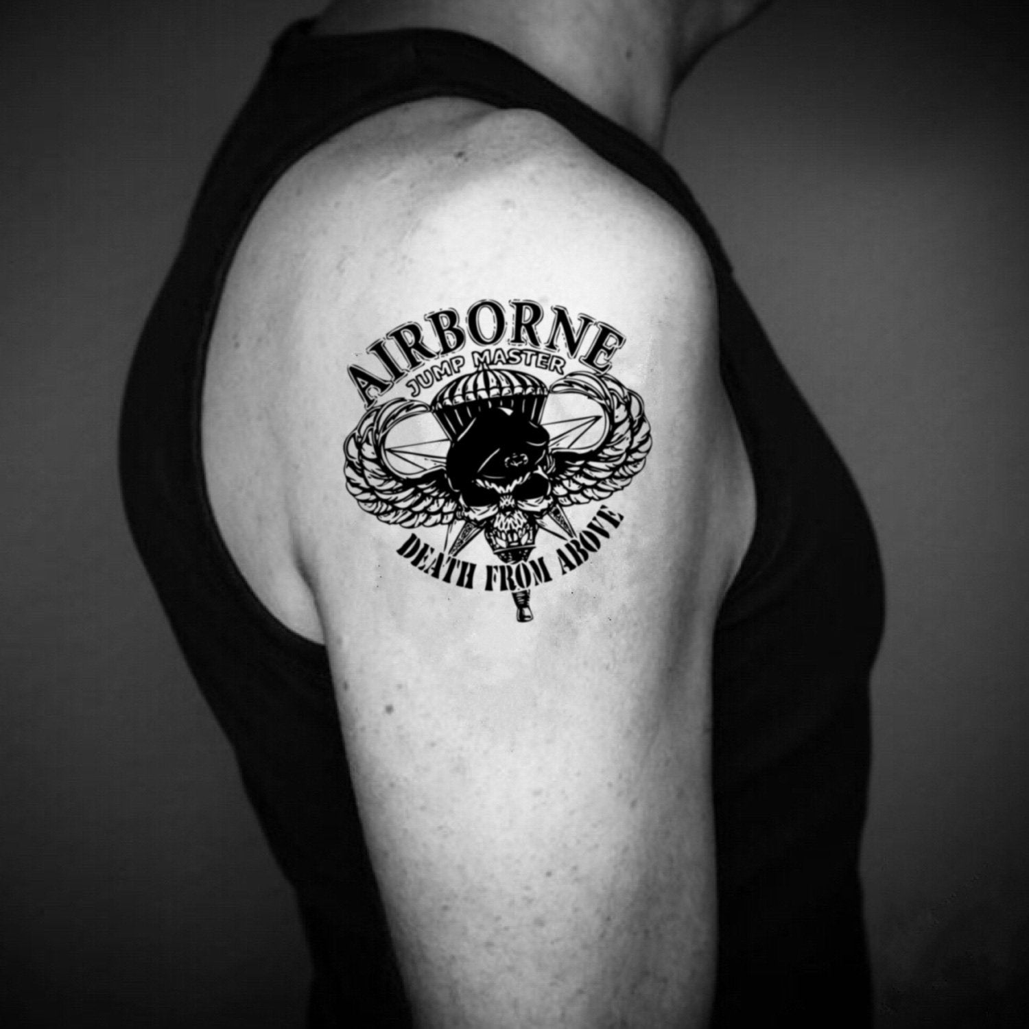 fake medium airborne bicep illustrative temporary tattoo sticker design idea on upper arm