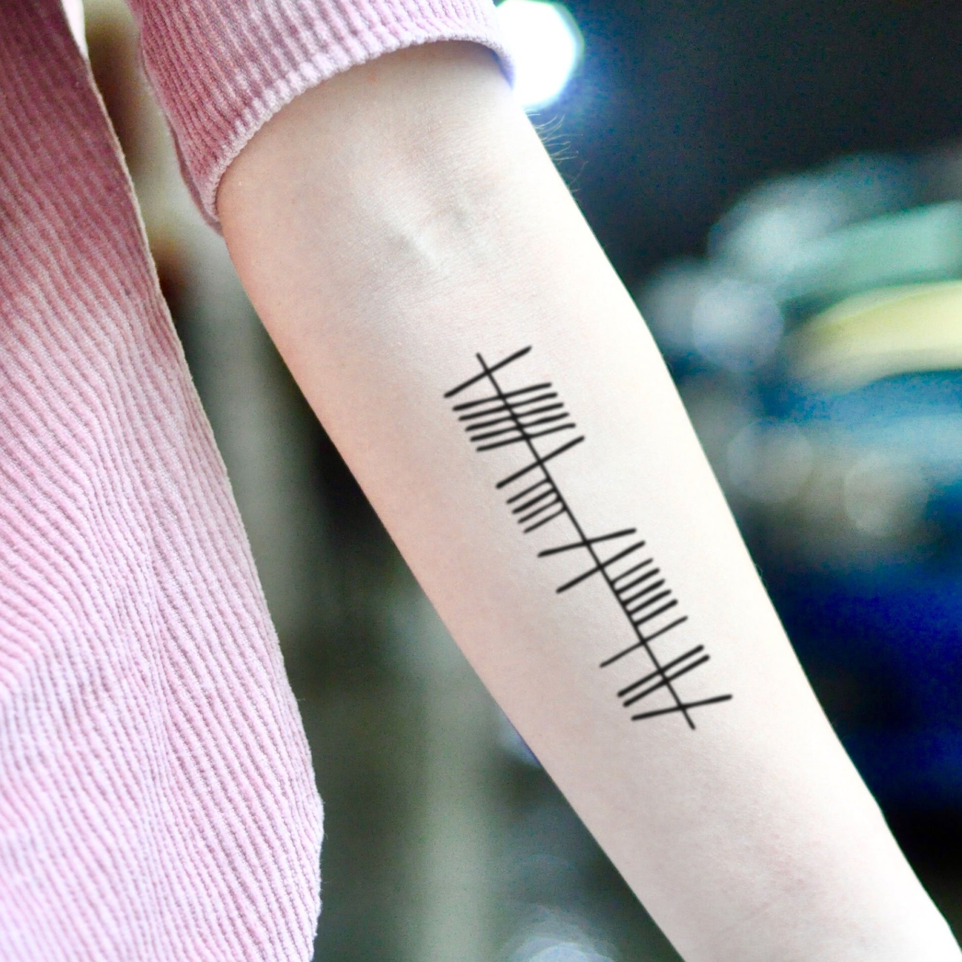 fake medium anam cara (soul friend) in ogham minimalist temporary tattoo sticker design idea on inner arm