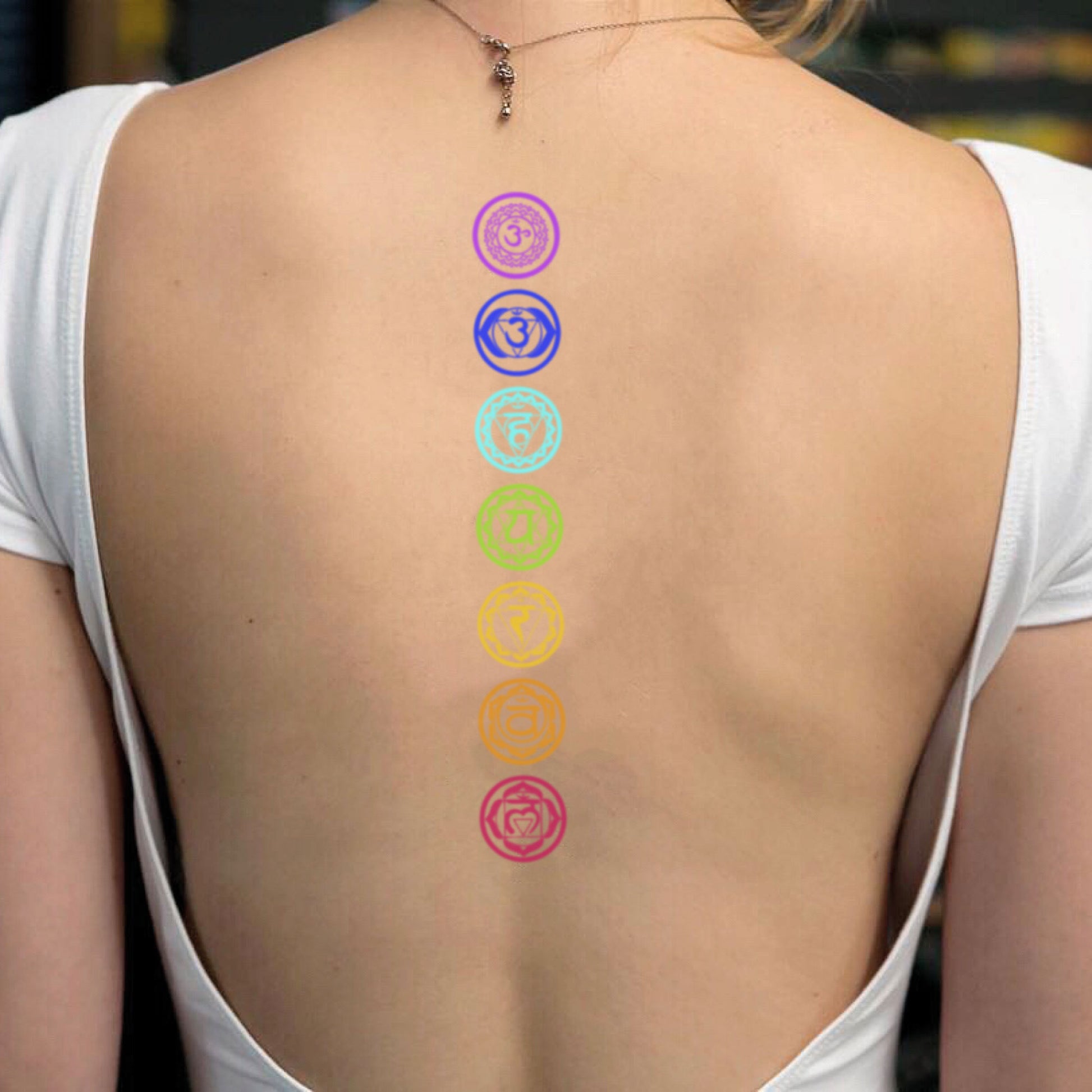 fake medium color chakra kundalini backbone spinal cord center middle back metaphysical illustrative temporary tattoo sticker design idea on spine