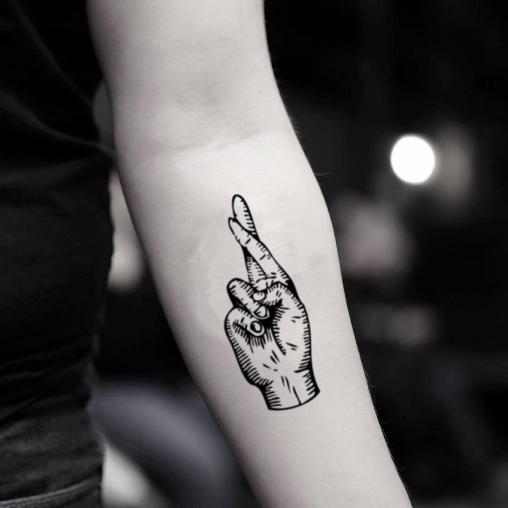 fake medium fingers crossed crosshatch illustrative temporary tattoo sticker design idea on inner arm
