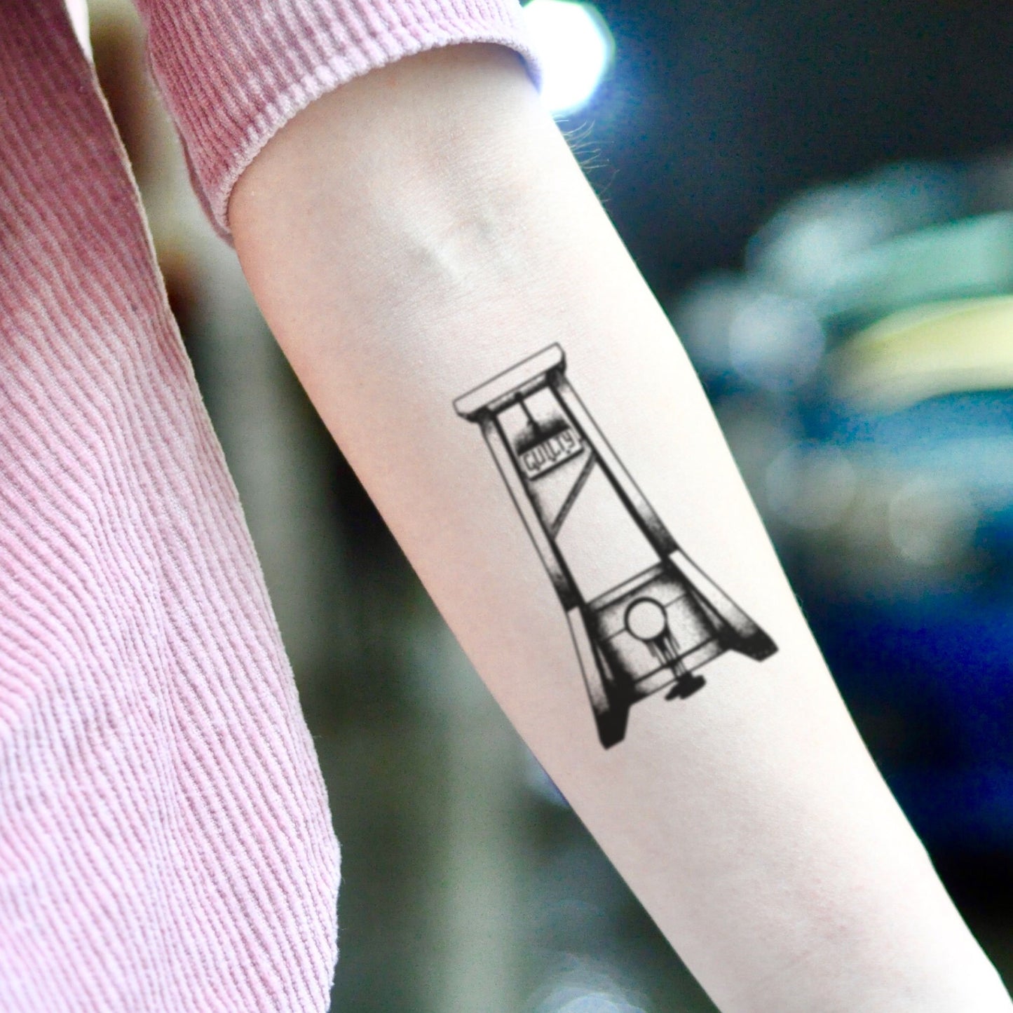 fake medium guillotine illustrative temporary tattoo sticker design idea on inner arm