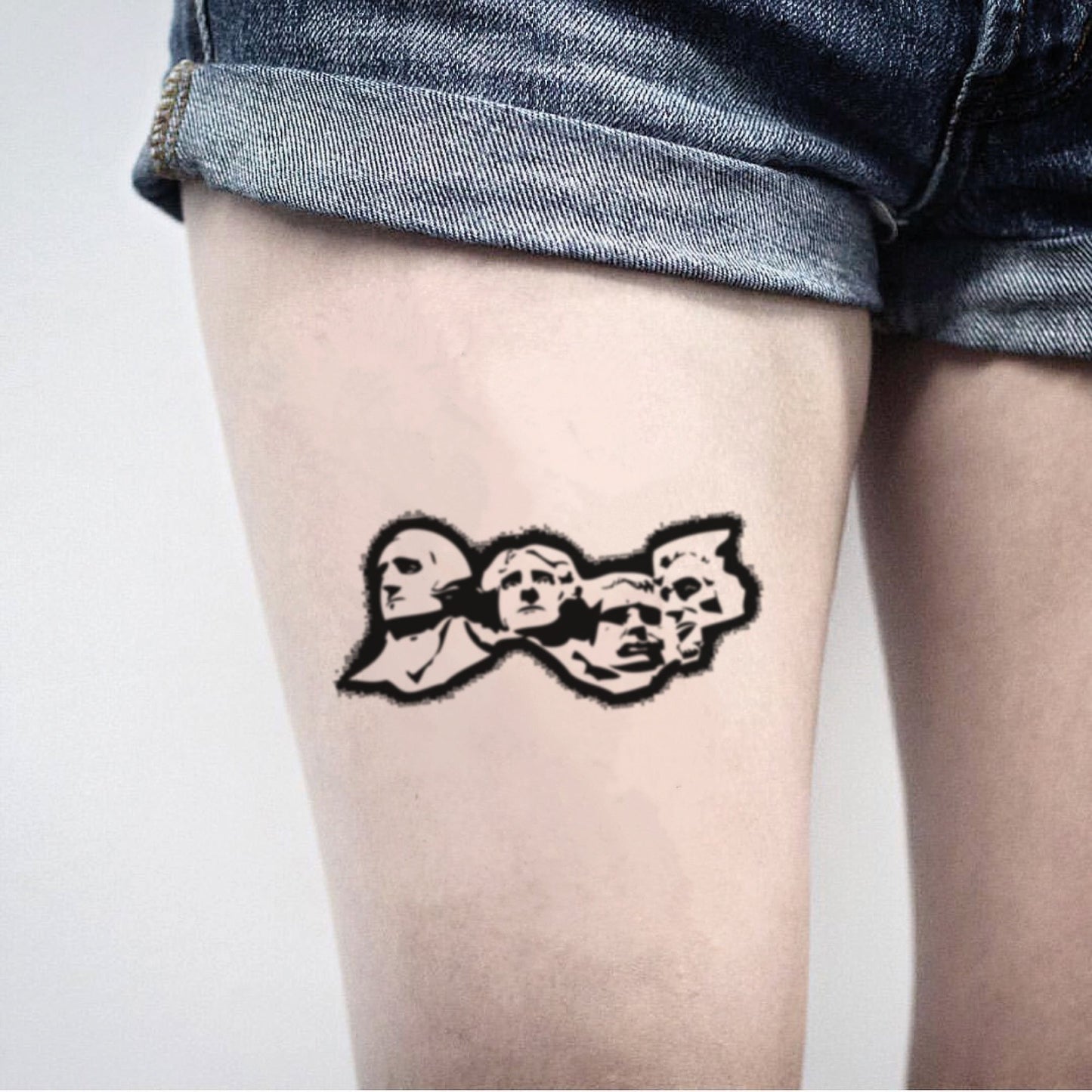 fake medium mount rushmore illustrative temporary tattoo sticker design idea on thigh