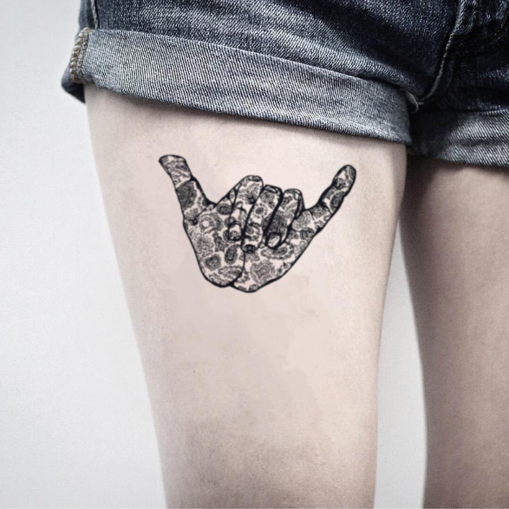 fake medium shaka hang loose illustrative temporary tattoo sticker design idea on thigh
