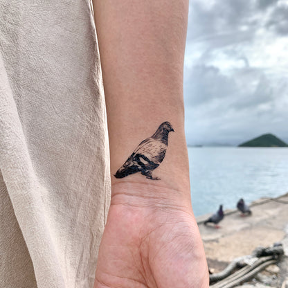 fake small pigeon animal temporary tattoo sticker design idea on wrist