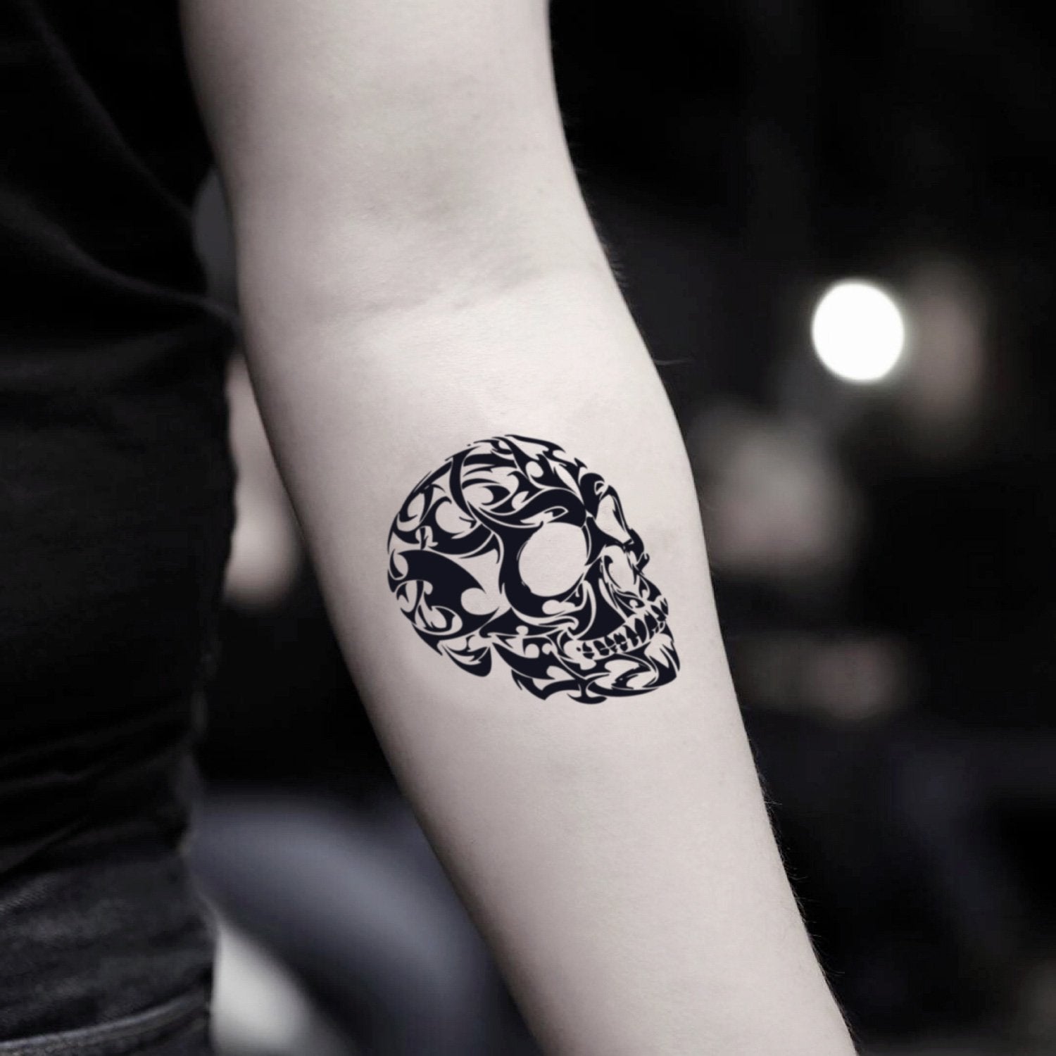 fake small 3 d skull illustrative temporary tattoo sticker design idea on inner arm