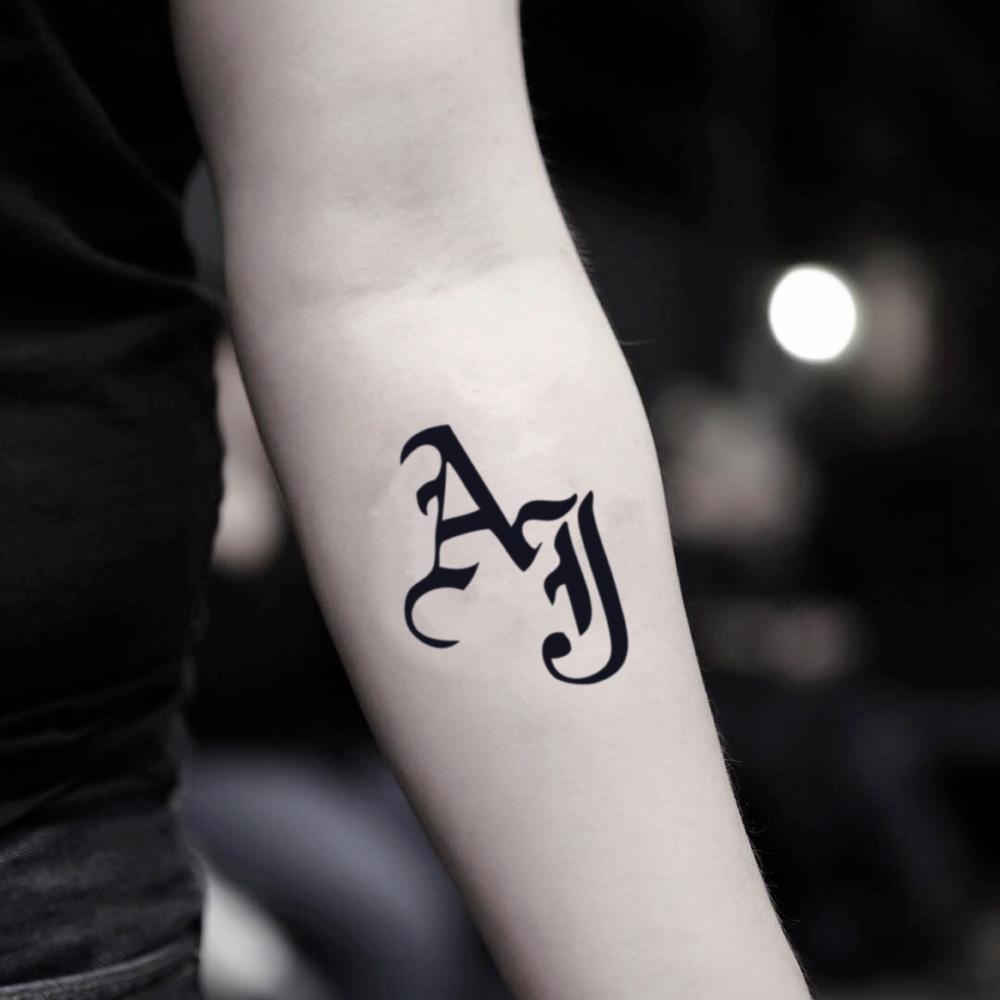 fake small aj styles lettering temporary tattoo sticker design idea on inner arm
