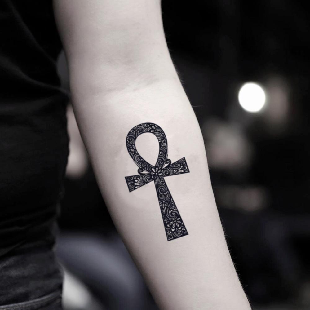 fake small ankh egyptian cross eternal life symbol illustrative temporary tattoo sticker design idea on inner arm