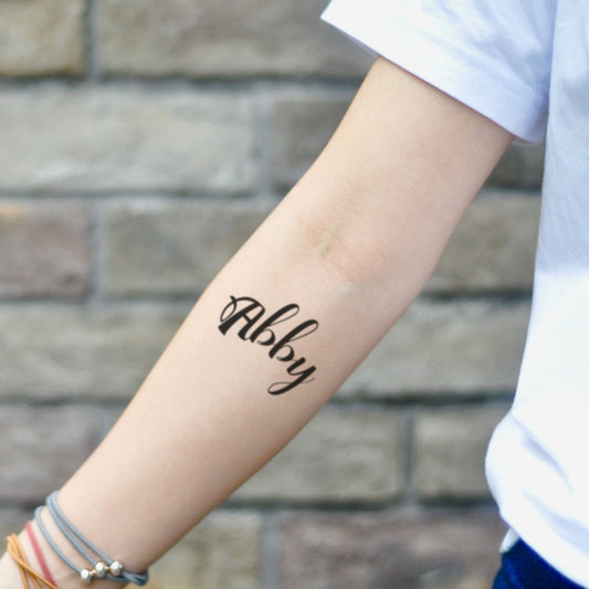 fake small abby lettering temporary tattoo sticker design idea on inner arm