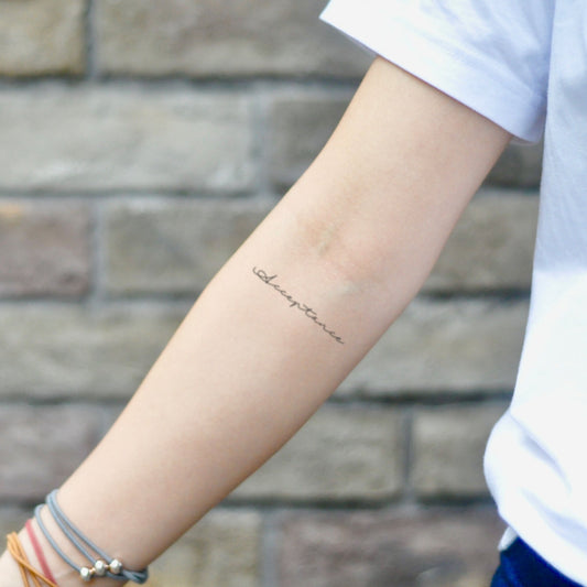 fake small acceptance lettering temporary tattoo sticker design idea on inner arm
