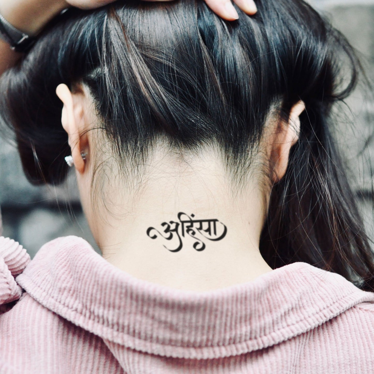 fake small ahimsa sanskrit lettering temporary tattoo sticker design idea on neck