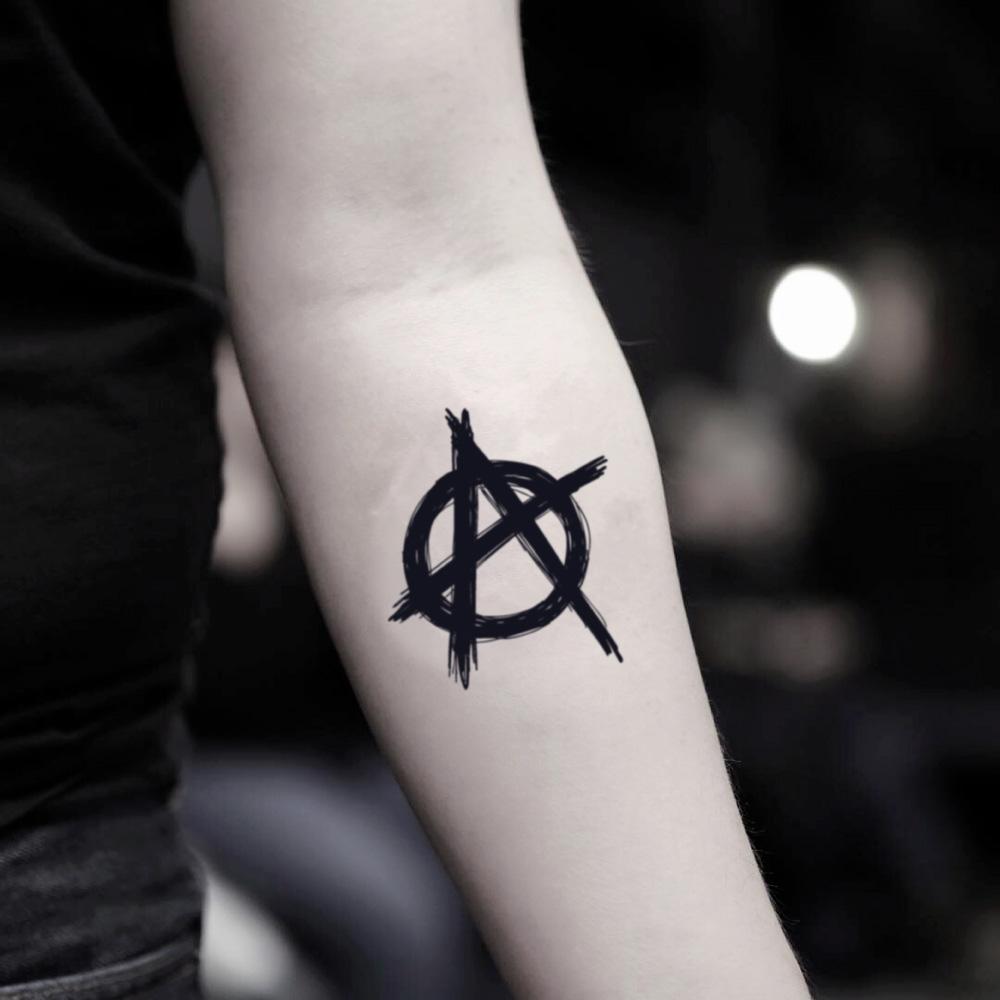 fake small anarchy illustrative temporary tattoo sticker design idea on inner arm