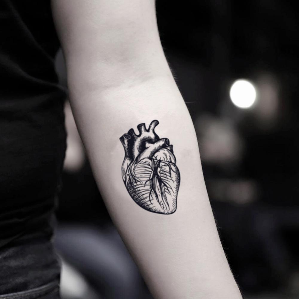 fake small anatomical heart biology illustrative temporary tattoo sticker design idea on inner arm