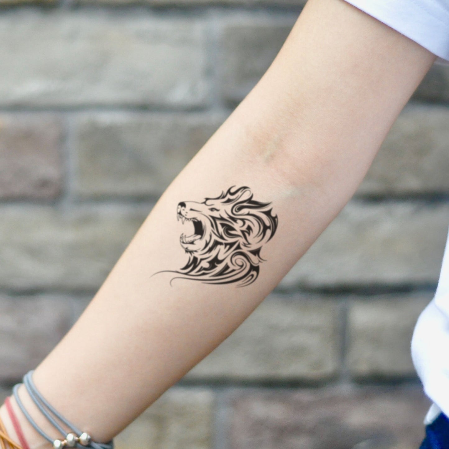 fake small angry lion head animal temporary tattoo sticker design idea on inner arm