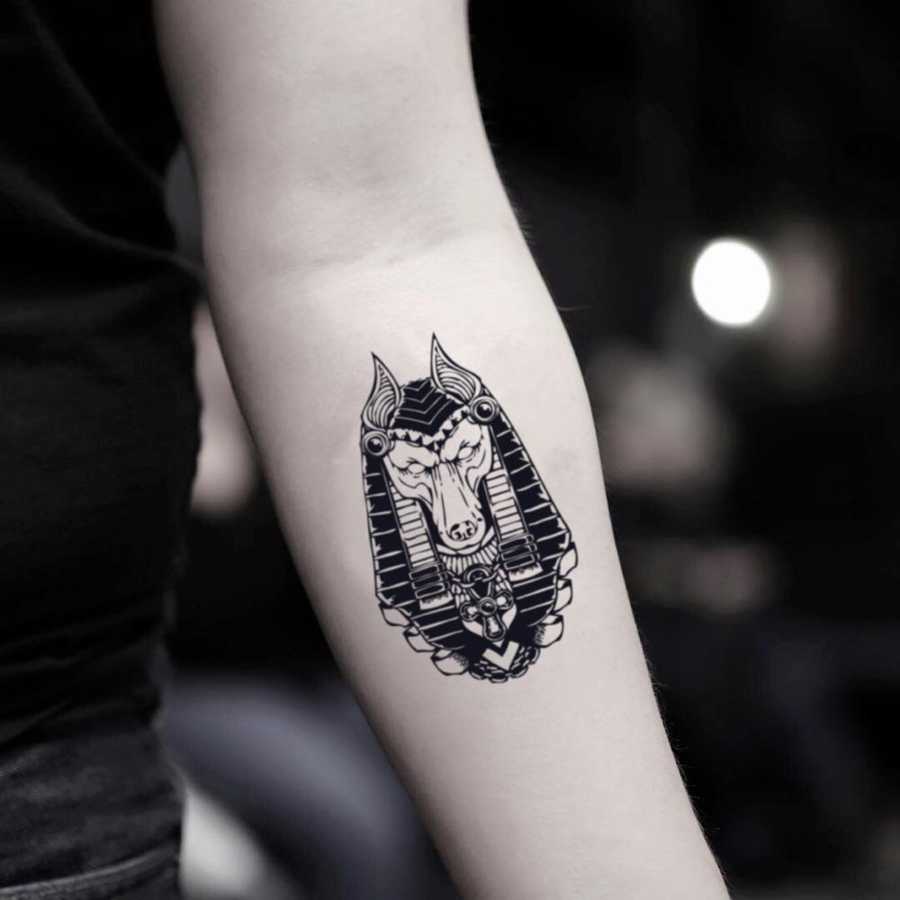 fake small osiris anubis jackal sekhmet illustrative temporary tattoo sticker design idea on inner arm