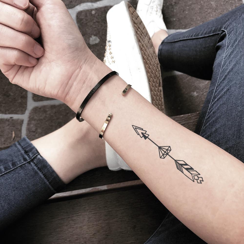 fake small spear arrow through diamond geometric temporary tattoo sticker design idea on forearm