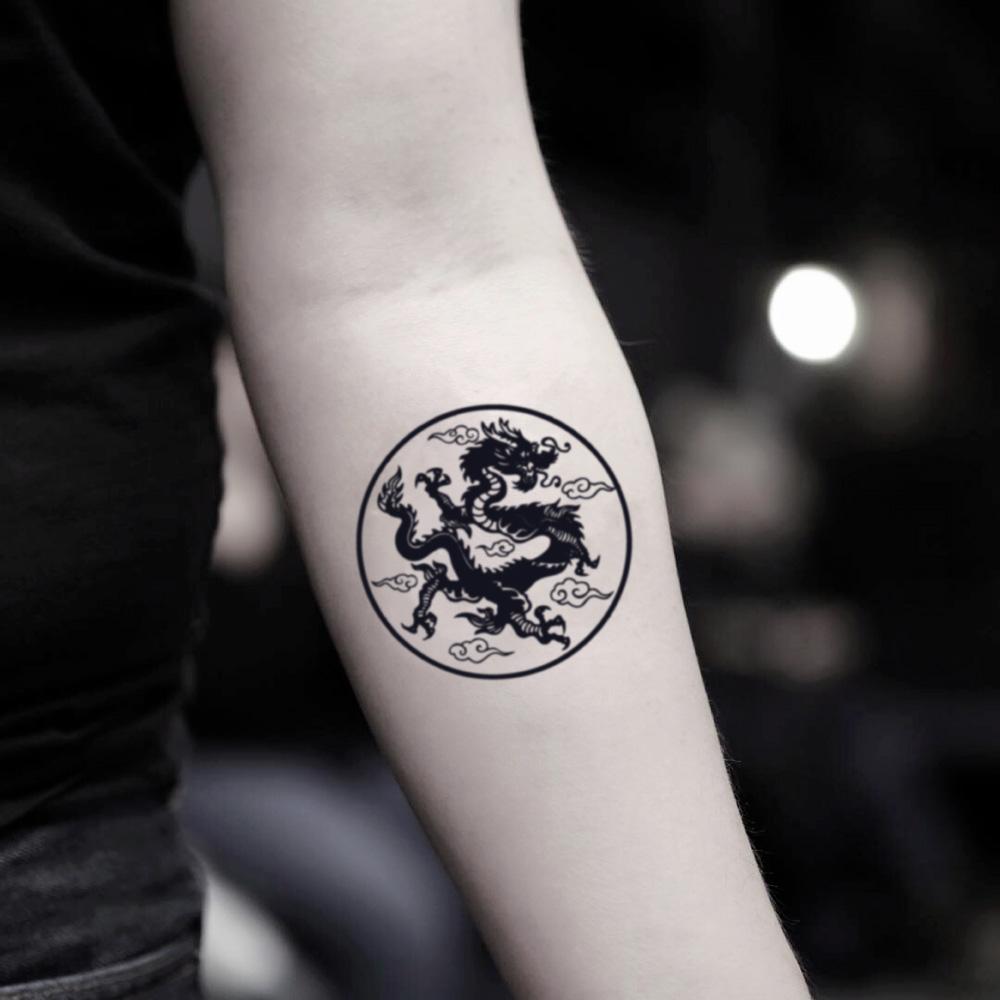 fake small asian earth dragon circle illustrative temporary tattoo sticker design idea on inner arm