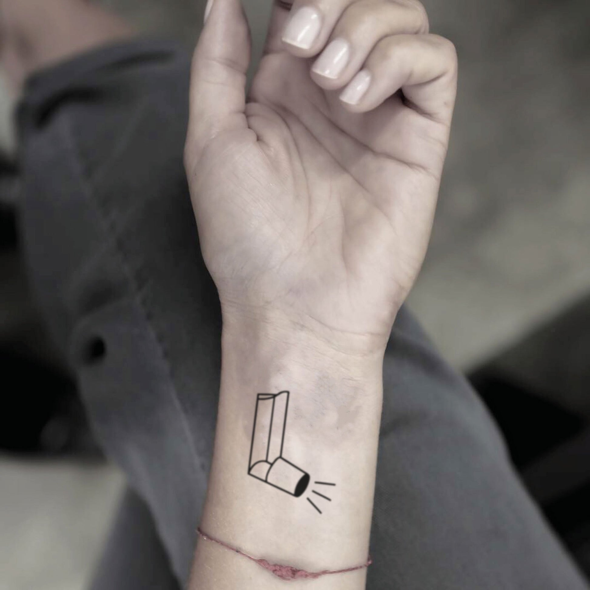 fake small asthma inhaler minimalist temporary tattoo sticker design idea on wrist