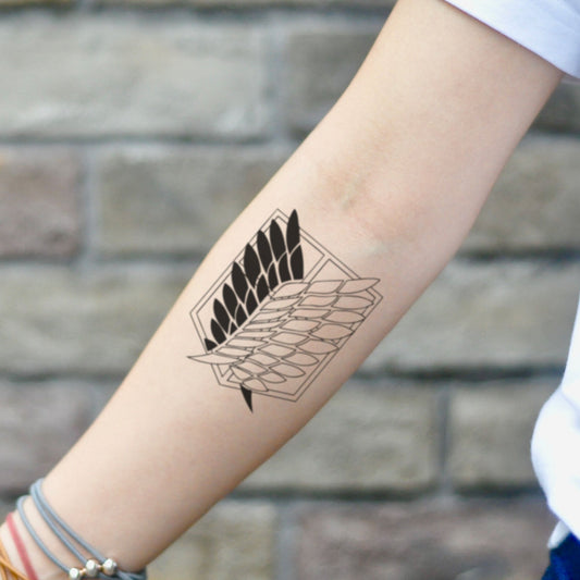 fake small attack on titan wings of freedom illustrative temporary tattoo sticker design idea on inner arm