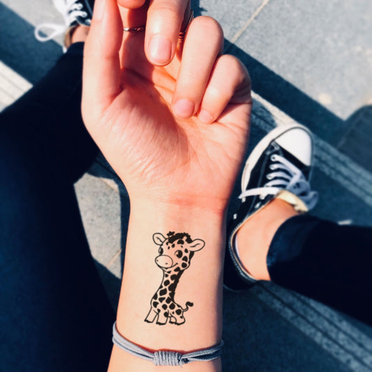 fake small baby giraffe animal temporary tattoo sticker design idea on wrist