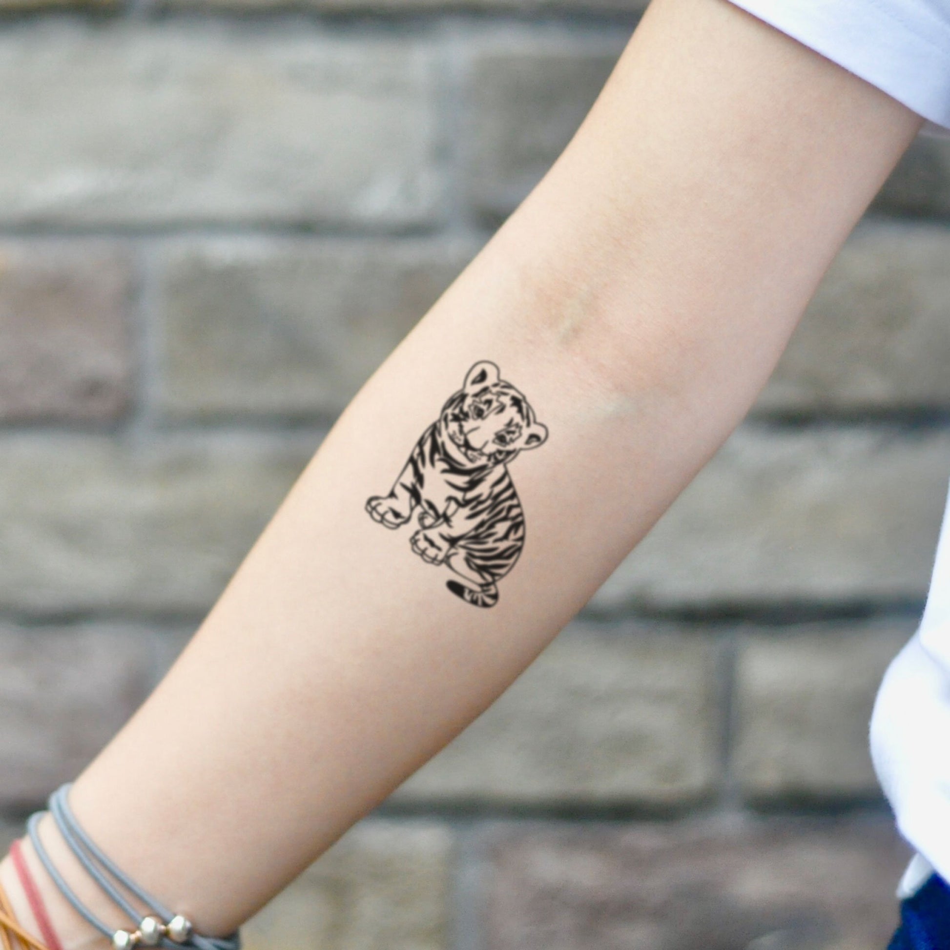 fake small baby lion tiger simba cub animal temporary tattoo sticker design idea on inner arm