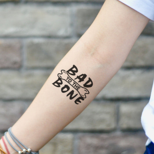 fake small bad to the bone illustrative temporary tattoo sticker design idea on inner arm