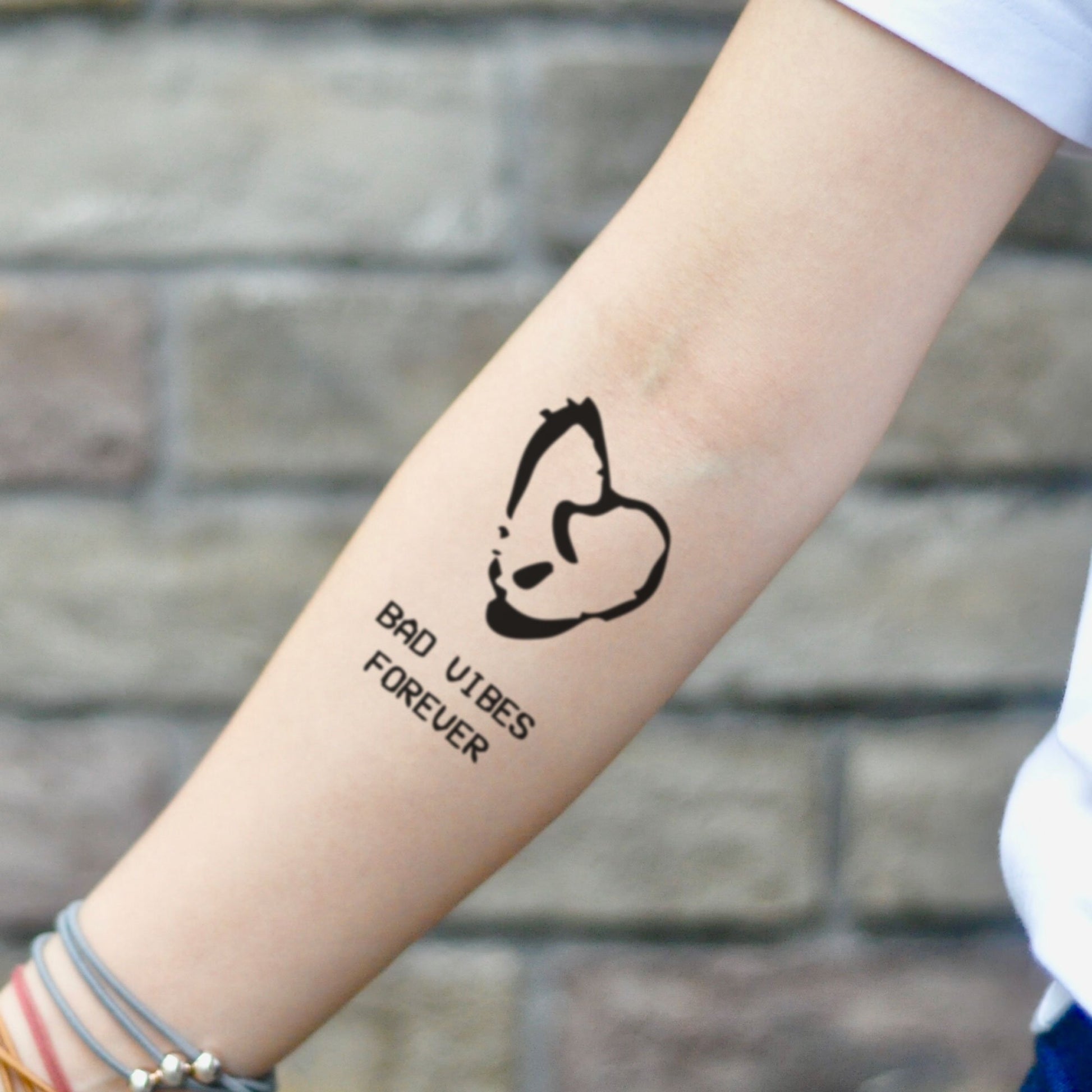 fake small bad vibes forever illustrative temporary tattoo sticker design idea on inner arm