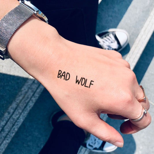 fake small bad wolf lettering temporary tattoo sticker design idea on hand
