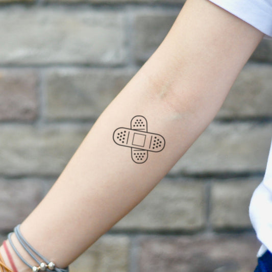 fake small band aid open wound bandage minimalist temporary tattoo sticker design idea on inner arm