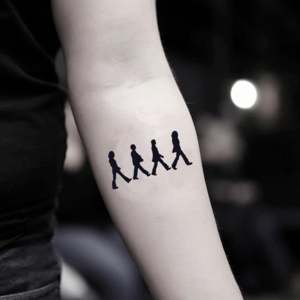 fake small beatles minimalist temporary tattoo sticker design idea on inner arm