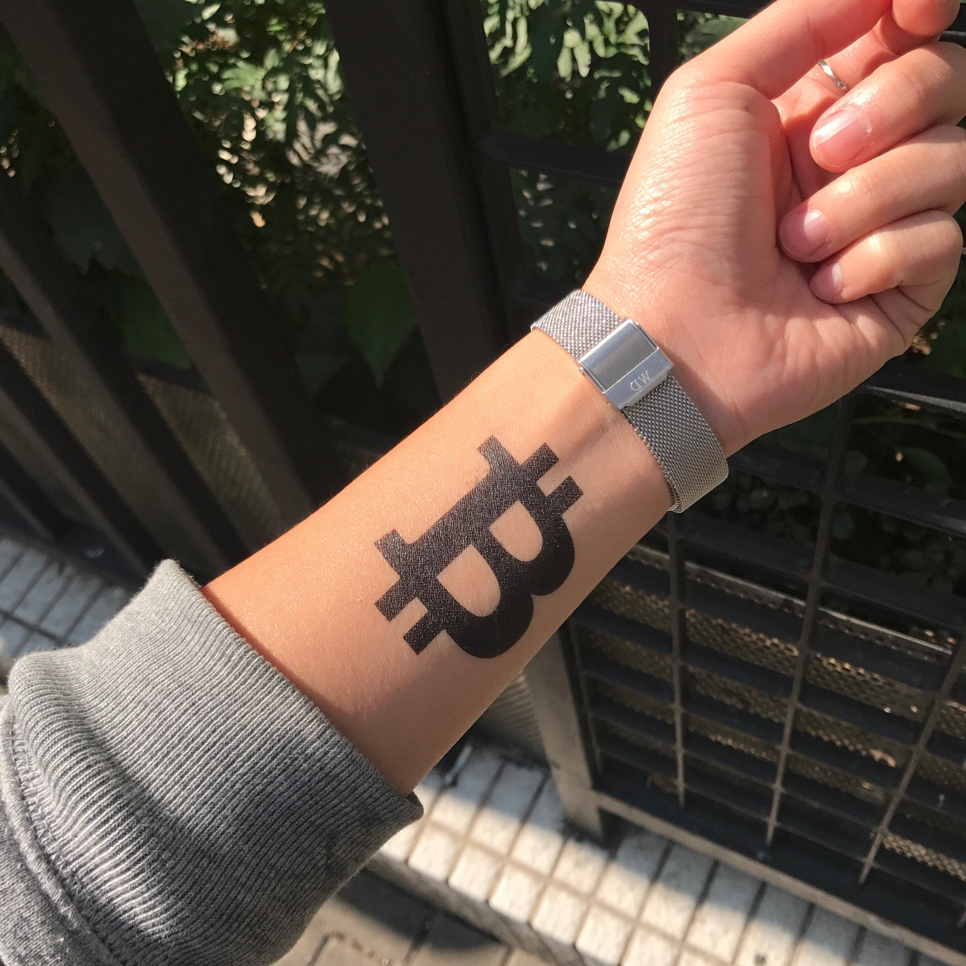 fake small bitcoin symbol minimalist temporary tattoo sticker design idea on wrist