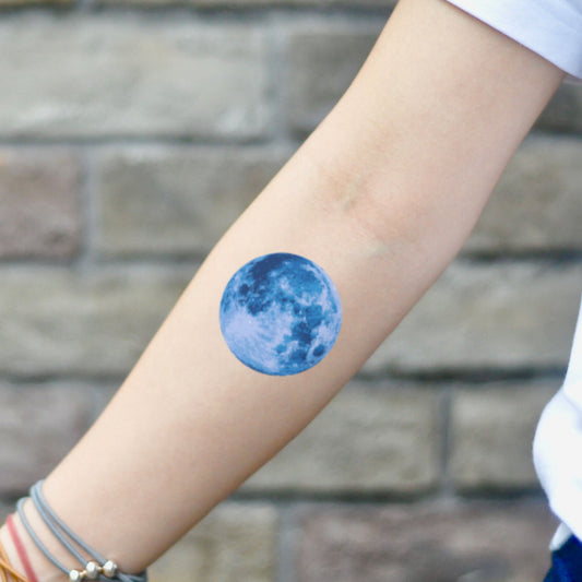 fake small blue moon color temporary tattoo sticker design idea on inner arm